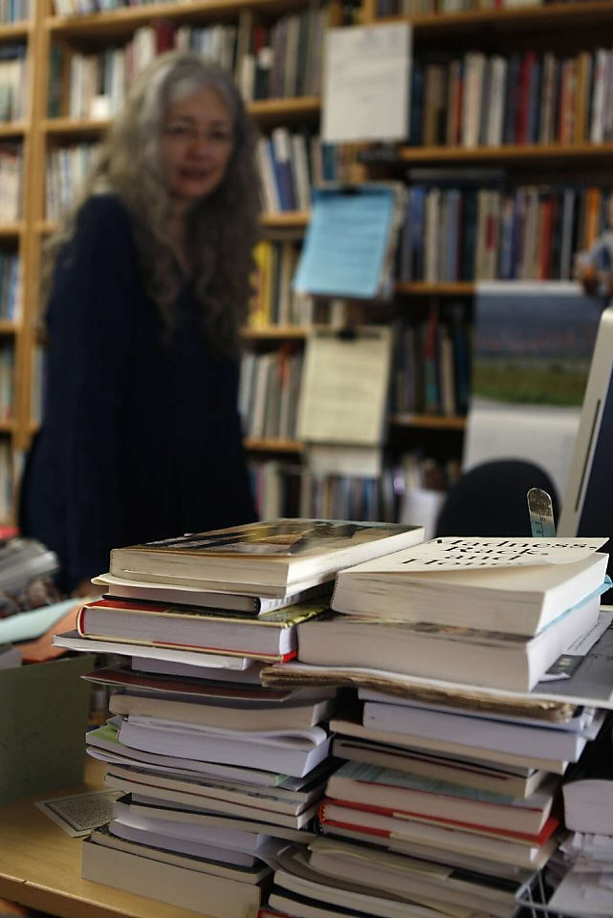 Director Joyce Jenkins of Poetry Flash has stacks of books to review at the office in Berkeley, Calif., on Thursday, September 27, 2012.