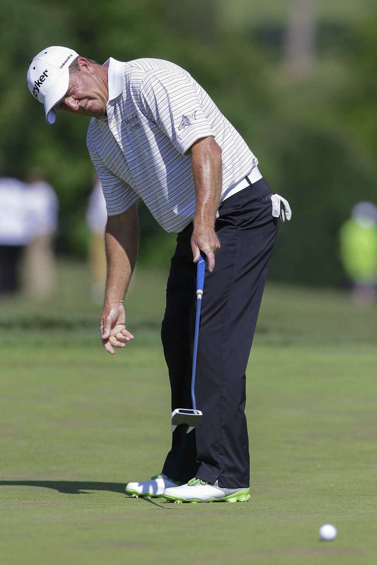 Fred Funk, missing a putt on the ninth hole Thursday, is one of seven leaders at the U.S. Senior Open.