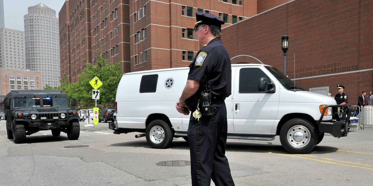 A U.S. Marshal's van, believed to be carrying Boston Marathon bombing suspect Dzhokhar Tsarnaev, arrives at the federal courthouse for his arraignment Wednesday, July 10, 2013, in Boston. The April15 attack killed three and wounded more than 260. The 19-year-old Tsarnaev has been charged with using a weapon of mass destruction, and could face the death penalty. (AP Photo/Josh Reynolds)