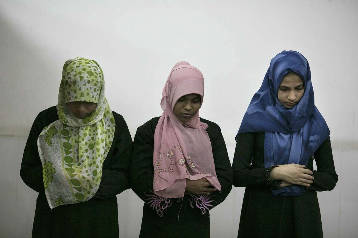 Muslim women and children attend a special evening Ramadan prayer in Colombo, Sri Lanka. Islam in Sri Lanka is practiced by a group of minorities who make up 9.7 percent of the population.