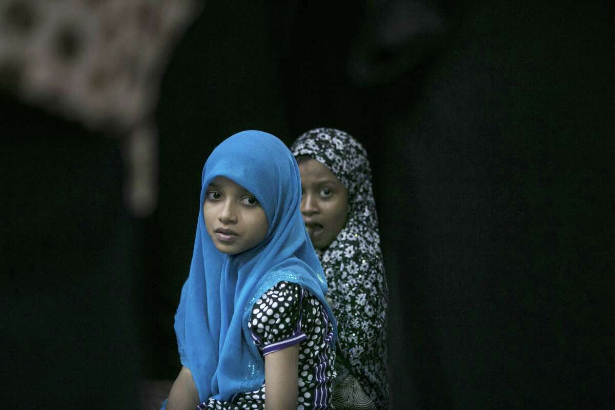 COLOMBO, SRI LANKA - JULY 10: Muslim children attend a special evening Ramadan prayer at the Juma Masjid July 10, 2013 in Colombo, Sri Lanka. Islam in Sri Lanka is practiced by a group of minorities who make up 9.72% of the population. (Photo by Paula Bronstein/Getty Images)