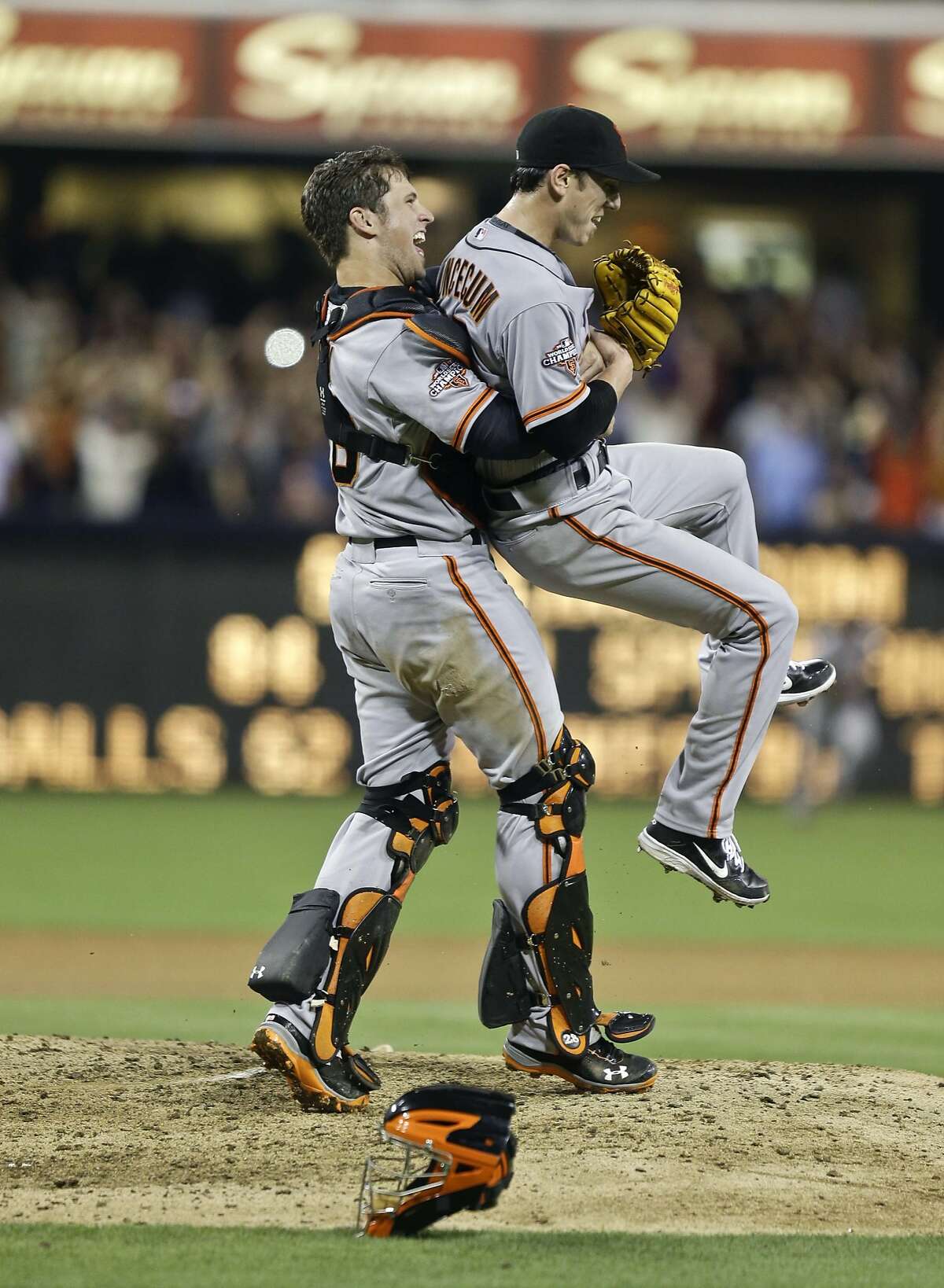 San Francisco Giants starting pitcher Tim Lincecum gets lifted by catcher Buster Posey after his no hit game against the San Diego Padres in a baseball game in San Diego, Saturday, July 13, 2013. The Giants won the game 9-0. Tim Lincecum has thrown his first career no-hitter and the second in the majors in 11 days, a gem saved by a spectacular diving catch by right fielder Hunter Pence in the San Francisco Giants' 9-0 win against the last-place San Diego Padres on Saturday night. (AP Photo/Lenny Ignelzi)