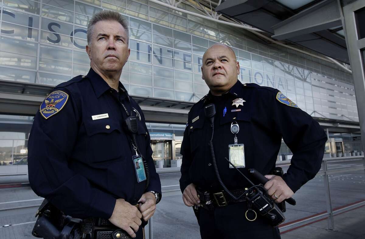 Officer James Cunningham, (left) and Lt. Gaetano Caltagirone, at the International terminal as they start their early morning shift at SFO. San Francisco police officers working at the International terminal police station were among the first on the scene of the crash-landing of Asiana Airlines flight 214.