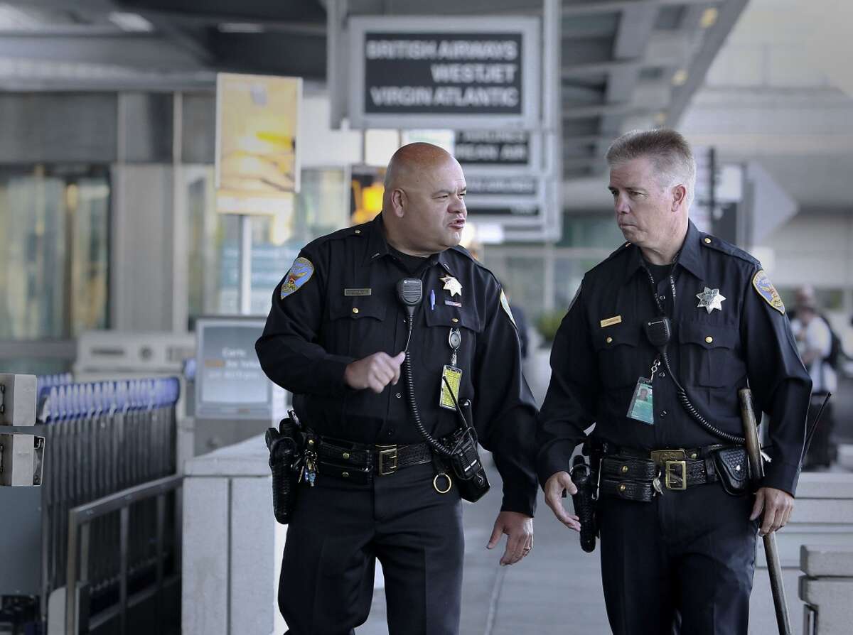 In this file photo, Lt. Gaetano Caltagirone, (left) and Officer James Cunningham, walk the exterior of the International terminal as they start their early morning shift at SFO on Saturday July 13, 2013, in San Francisco, Calif. Officers throughout the Bay Area were on heightened alert Sunday, Aug. 4, 2013, following a global travel advisory.
