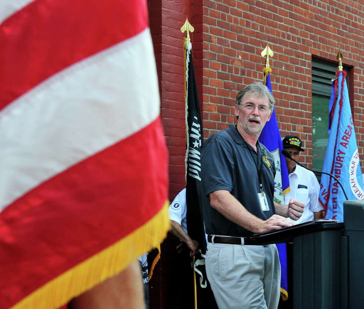 Thomas Quinn, of the U.S. Department of Vereran Affairs, is the guest speaker, as the Veterans Walkway of Honor dedication ceremony takes place at the Danbury War Memorial, in Danbury, Conn. Sunday, July 14, 2013.