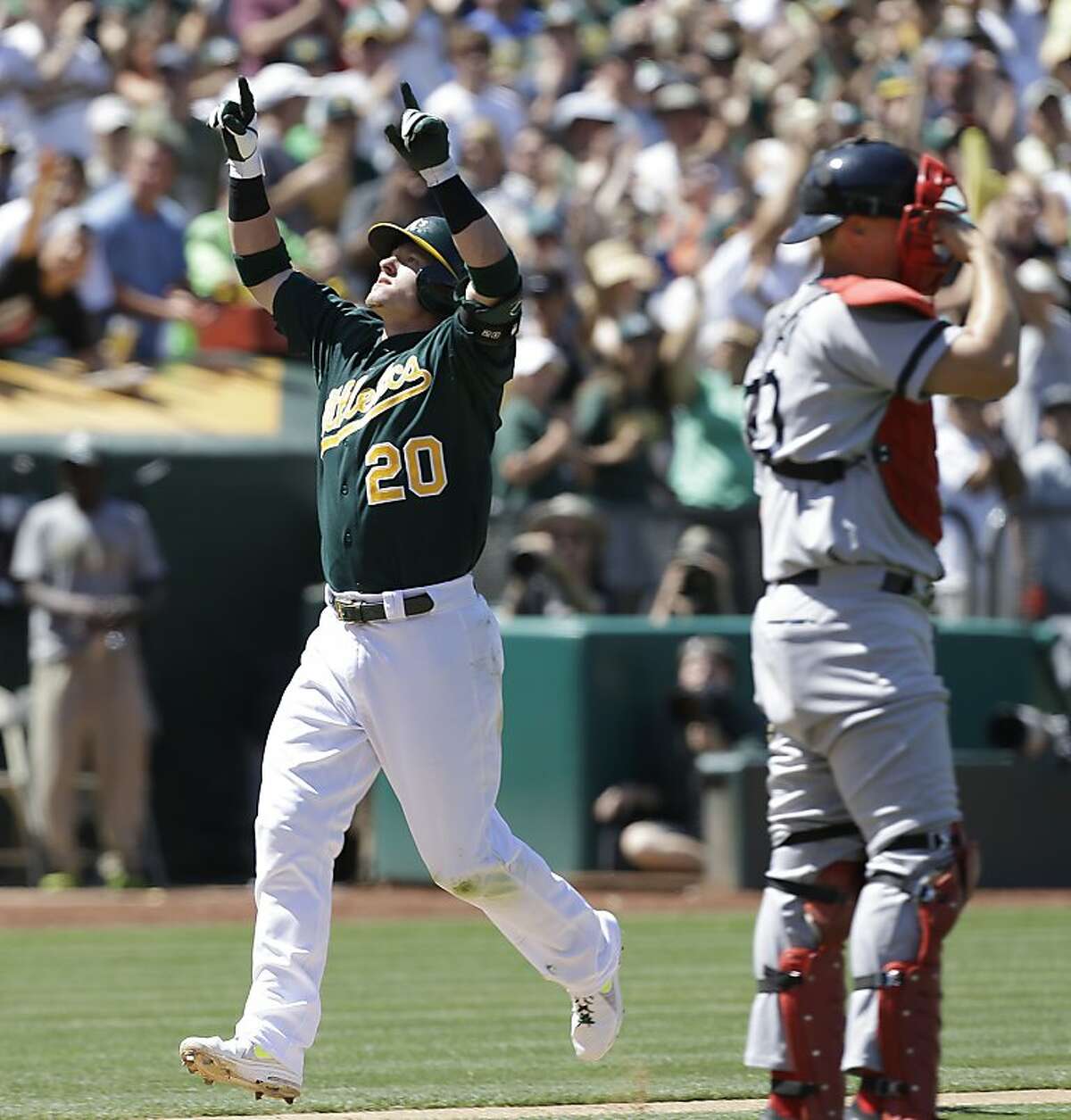 Oakland Athletics' Josh Donaldson (20) celebrates after hitting a two-run home run off Boston Red Sox's Brandon Workman in the seventh inning of a baseball game Sunday, July 14, 2013, in Oakland, Calif. (AP Photo/Ben Margot)