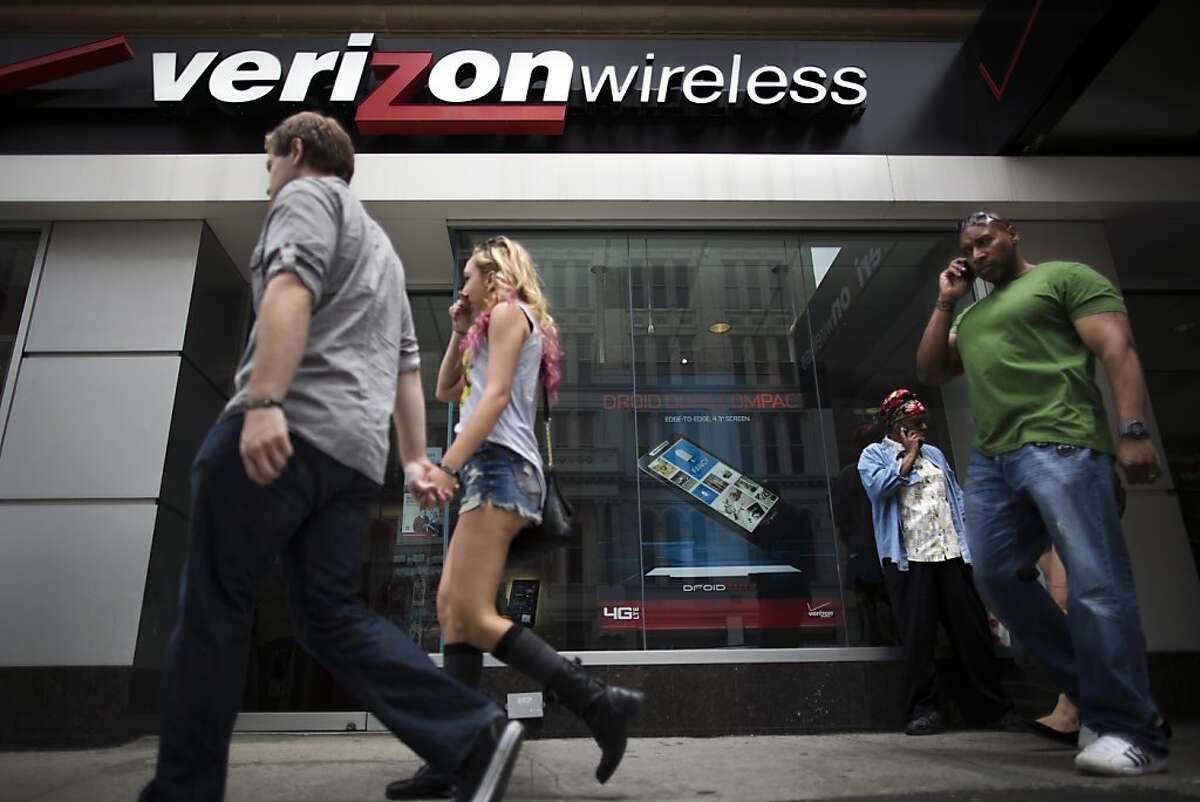 Pedestrians pass a Verizon Wireless store on Canal Street, Thursday, June 6, 2013, in New York. The Obama administration on Thursday, June 6, 2013, defended the government's need to collect telephone records of American citizens, calling such information "a critical tool in protecting the nation from terrorist threats." Britain's Guardian newspaper reported that the NSA has been collecting the telephone records of millions of Verizon customers under a top secret court order. (AP Photo/John Minchillo)