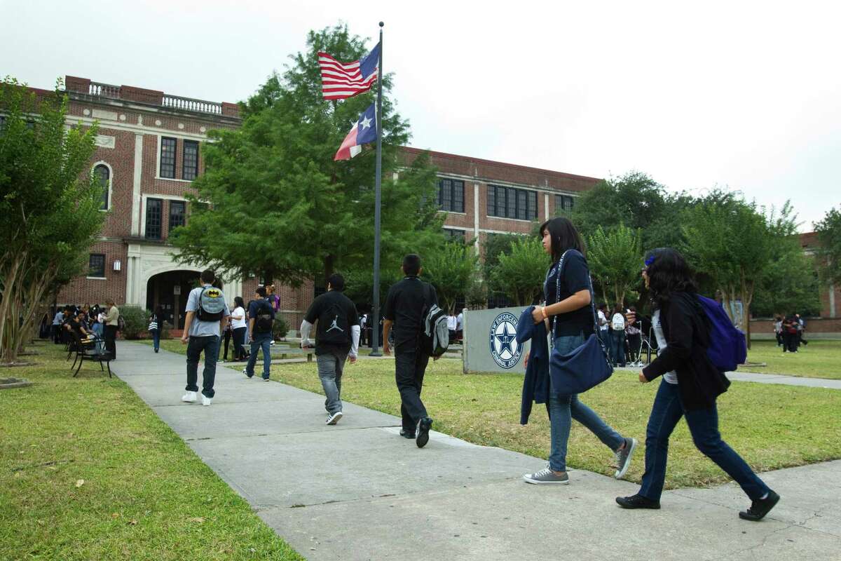 Students arrive to the High School for Law Enforcement and Criminal Justice Wednesday, May 25, 2011, in Houston.