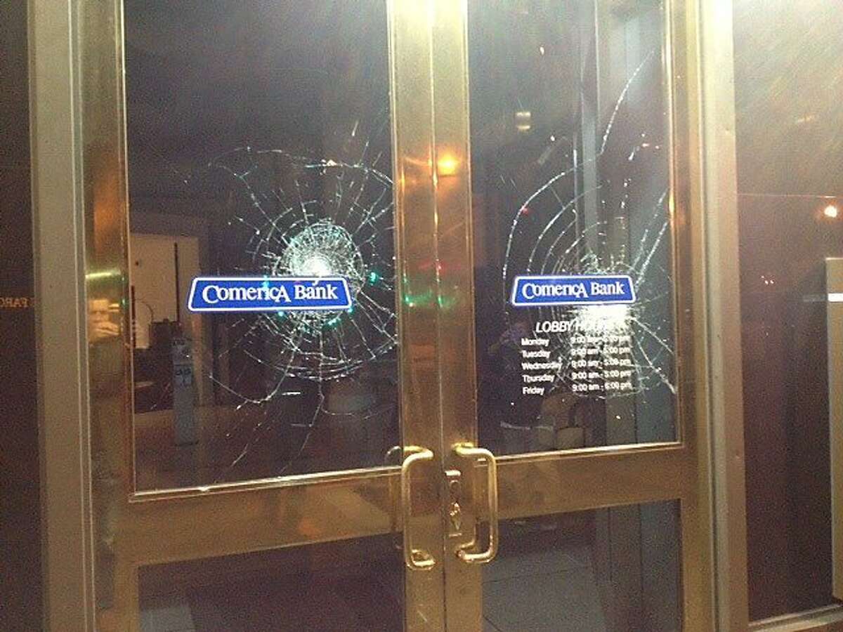 Smashed windows are seen at Comerica Bank on July 15, 2013 in Oakland, Calif.