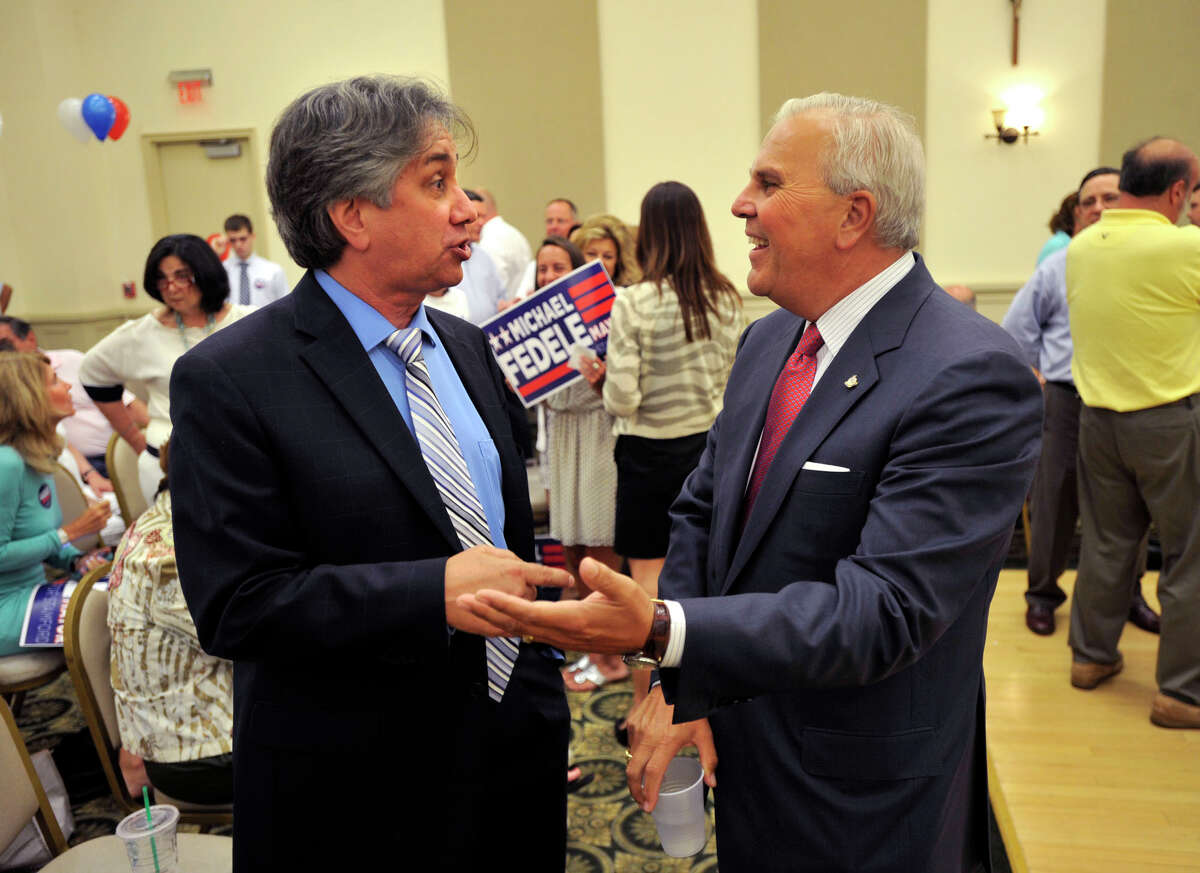 Republican candidates for mayor of Stamford Jerry Pia, left, and Michael Fedele speak to one another during a break from the Republican Town Committee meeting at the Knights of Columbus in Stamford on Tuesday, July 16, 2013.
