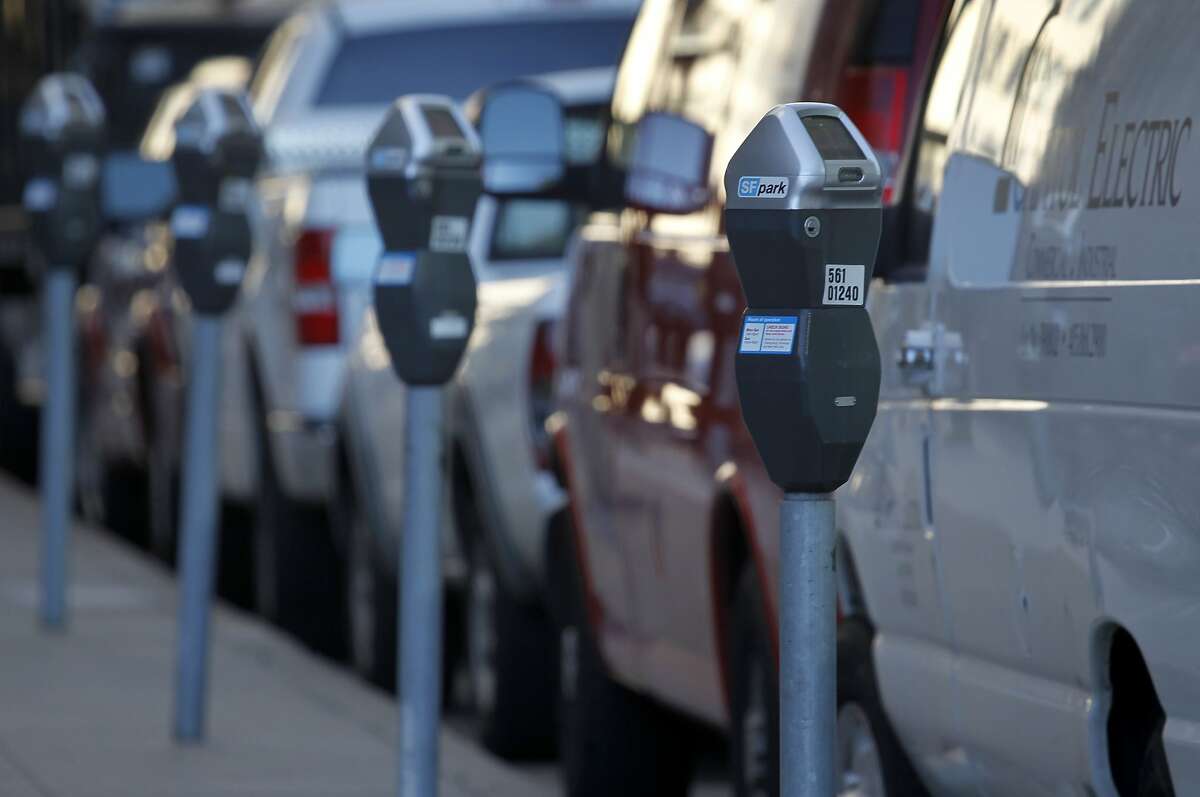 Cars and vans are parked in metered spaces on Main Street in San Francisco, Calif. on Friday, June 28, 2013. The violation for parking at expired meters jumps to $74 on July 1, making it the most expensive fine in the country.