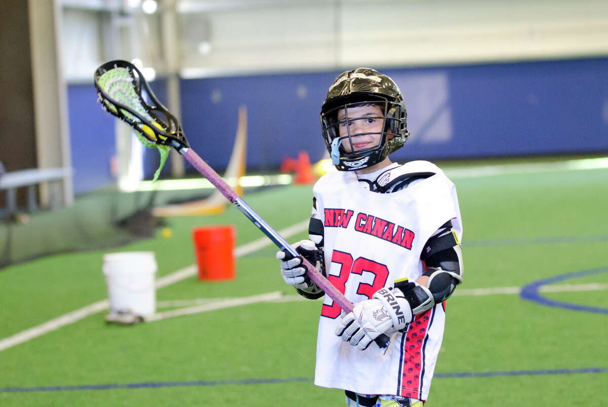 Diego Ferreir, of New Canaan, controls the ball during the Boys Lacrosse Summer Camp at the SONO Field House in Norwalk on Wednesday, July 17, 2013.