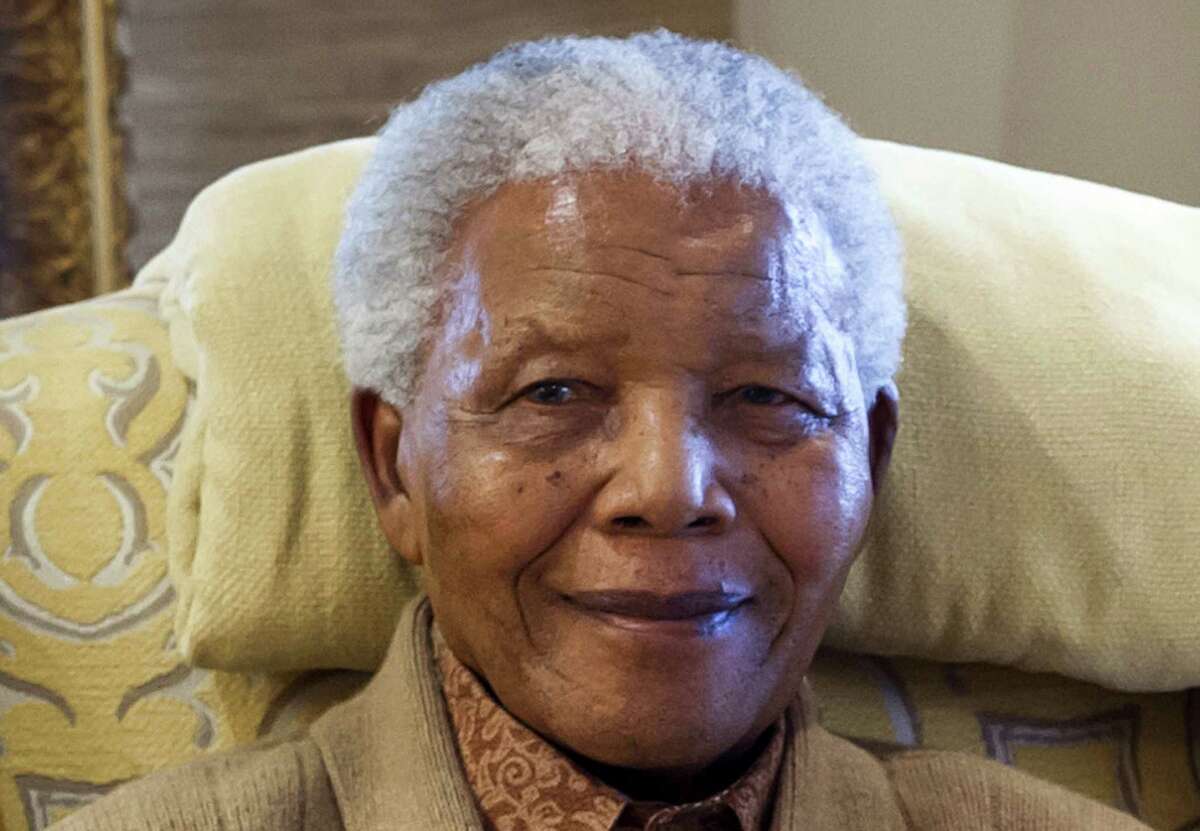 (FILES) This picture taken on July 17, 2012 shows former South African President Nelson Mandela during a visit by former US president at his home in Qunu, Eastern Cape, on the eve of his 94th birthday. Global celebrations and charity events will mark Nelson Mandela's 95th birthday on July 18, 2013 but the critically ill anti-apartheid hero himself may still be confined to his Pretoria hospital bed on life-support. = RESTRICTED TO EDITORIAL USE - MANDATORY CREDIT "AFP PHOTO - CLINTON FOUNDATION / BARBARA KINNEY"- NO MARKETING NO ADVERTISING CAMPAIGNS - DISTRIBUTED AS A SERVICE TO CLIENTS =BARBARA KINNEY/AFP/Getty Images