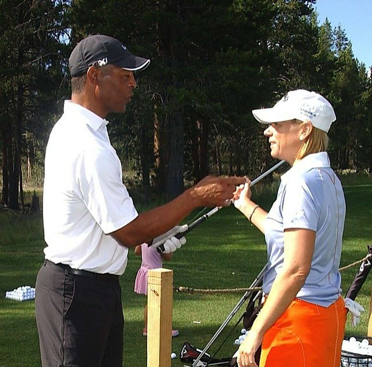 Retired LPGA great Annika Sorenstam gives some coaching tips to former Raider running back Marcus Allen. Friends and colleagues of former Raider player and coach Gene Upshaw gathered in Lake Tahoe for a benefit golf tournament to raise money for brain injury research and Upshaw's cancer treatment center.