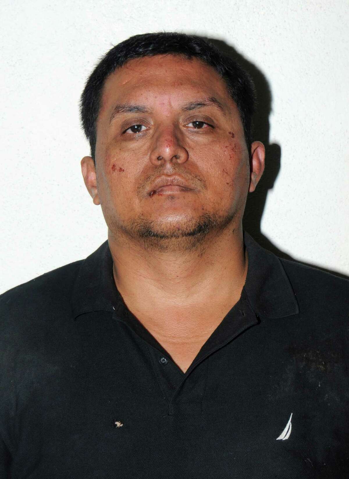 In this handout photo released by the Mexican Navy SEMAR on July 16, 2013, a photo of Miguel Angel Trevino Morales after he was captured near the Texas border. The capture of Trevino, the leader of the Zetas drug cartel, was a retort from Mexico's government to questions over whether it would go after top organized crime leaders. (Mexican Navy SEMAR, via New York Times) -- EDITORIAL USE ONLY