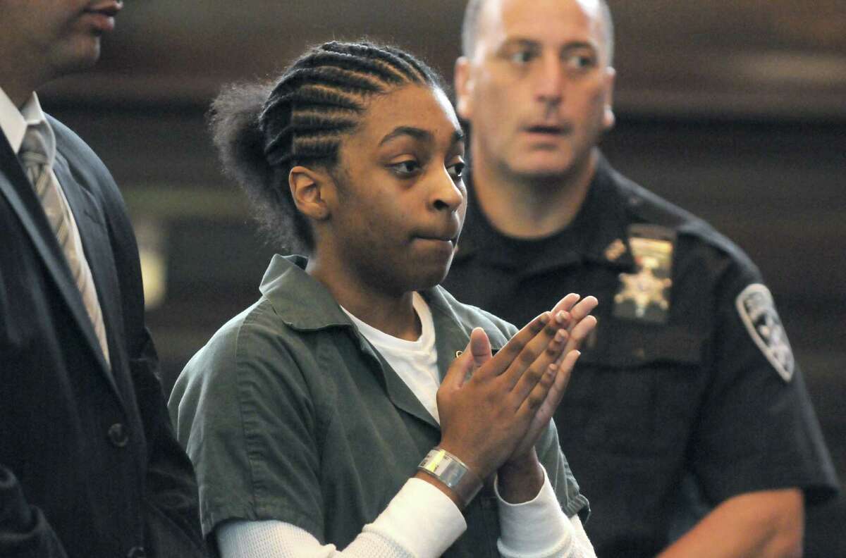 Keyanna Bradley, center, agrees to a plea agreement in the murder of Takim Smith before Judge Patrick McGrath Thursday morning, July 18, 2013, in Troy, N.Y. (Michael P. Farrell/Times Union)