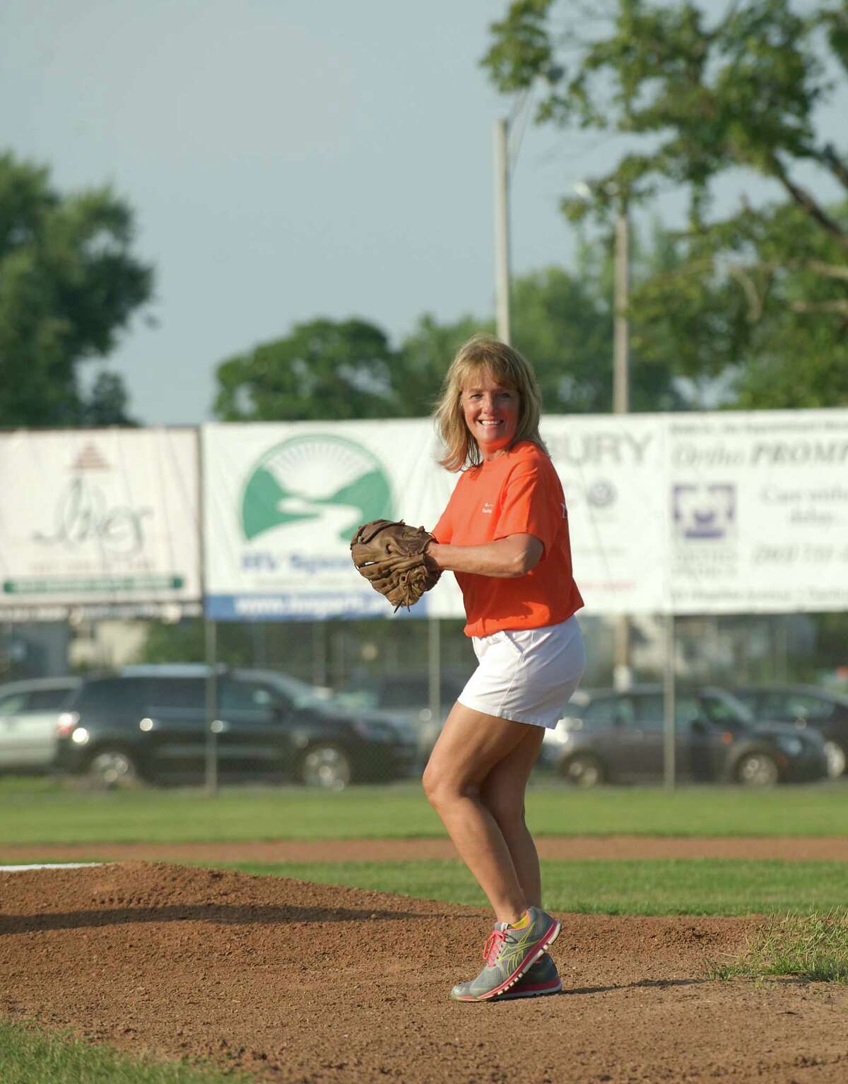 Throwing the the first pitch of the Danbury Westerners ball game is Nancy Symanowitz, RN. The Westerners were honoring the Carolyn M. Deering, RN, Memorial Nursing Education Fund and all registered nurses from Danbury Hospital at Rogers Park, in Danbury Conn on July 18, 2013.
