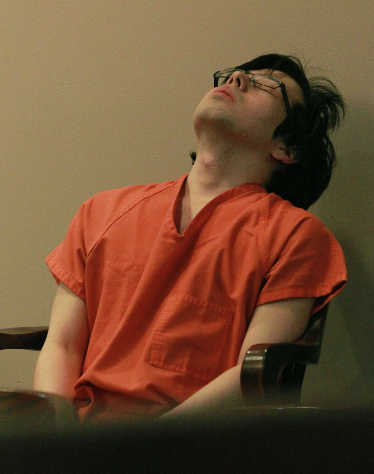 Defendant Yu Masaki leans back in the 144th District Court prior to sentencing Thursday July 18, 2013. Masaki pleaded guilty in March to shooting and killing Juan Carlos "J.C." Escamilla and also shooting and wounding Margaret "Maggie McCombs. Masaki received a life sentence for the crimes.