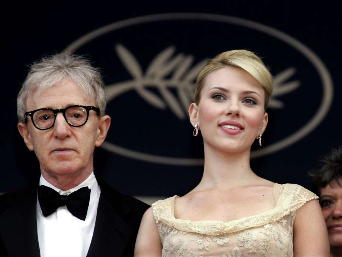 U.S. director Woody Allen (L) poses with U.S. actress Scarlett Johansson during red carpet arrivals for the out-of-competition screening of his film "Match Point" at the 58th Cannes Film Festival in this May 12, 2005 file photo. There's an undercurrent of deja vu coursing through Woody Allen's new comedy "Scoop," starting with its London setting. But perhaps most significantly, Scarlett Johansson, the leading lady of Allen's last film, "Match Point," once again plays a displaced American woman -- though in "Scoop" she's more damsel in distress than femme fatale. REUTERS/Pascal Deschamps/Files (FRANCE)