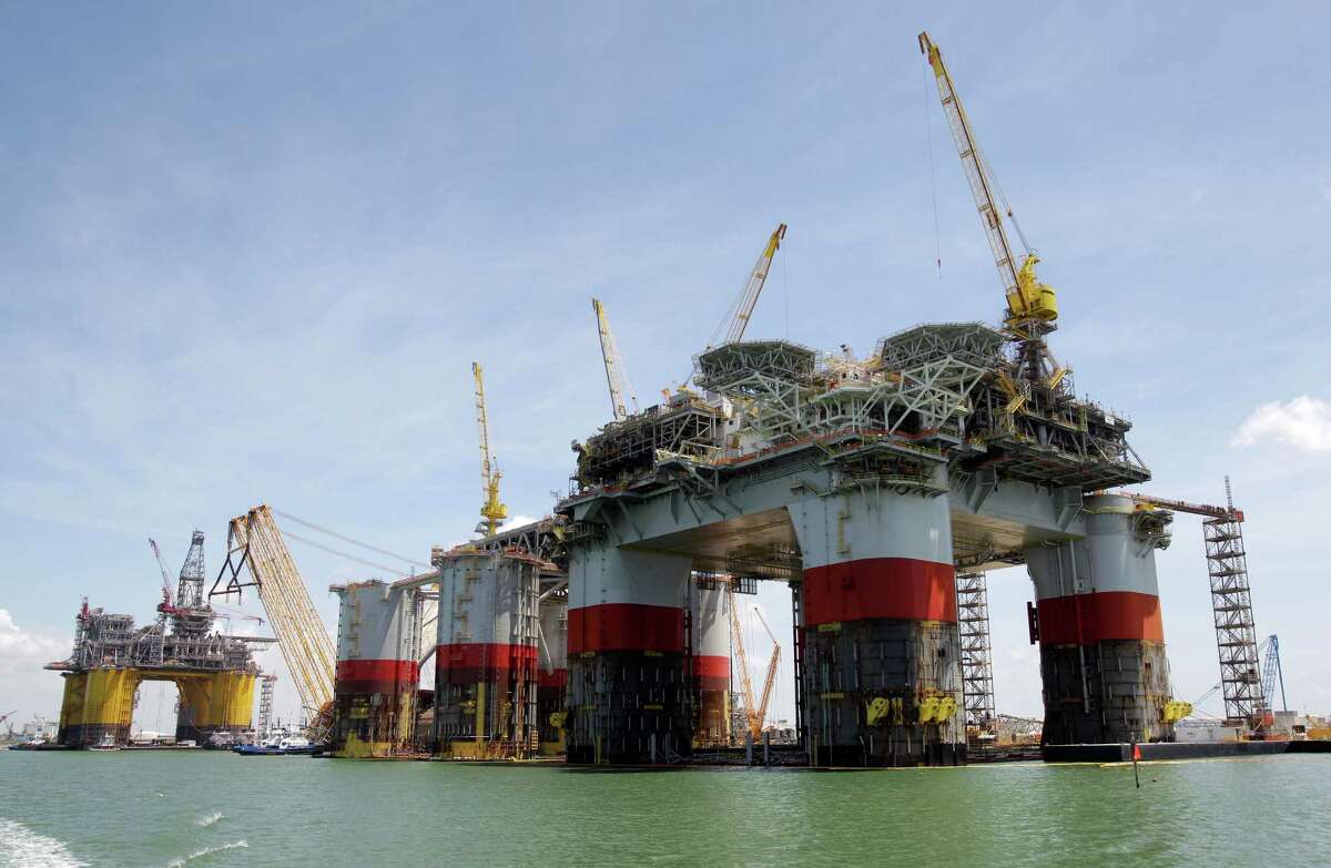 Oil platforms rise high to reach for the deep