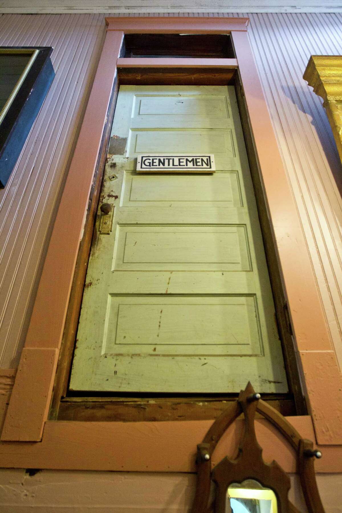 The mens bathroom, which now leads to a set of stairs built in the 1960's was for the Johns who visited the oleander Hotel when it was a brothel. The building is now the Antique Warehouse, , Thursday, July 18, 2013, in Galveston. ( Nick de la Torre / Houston Chronicle )