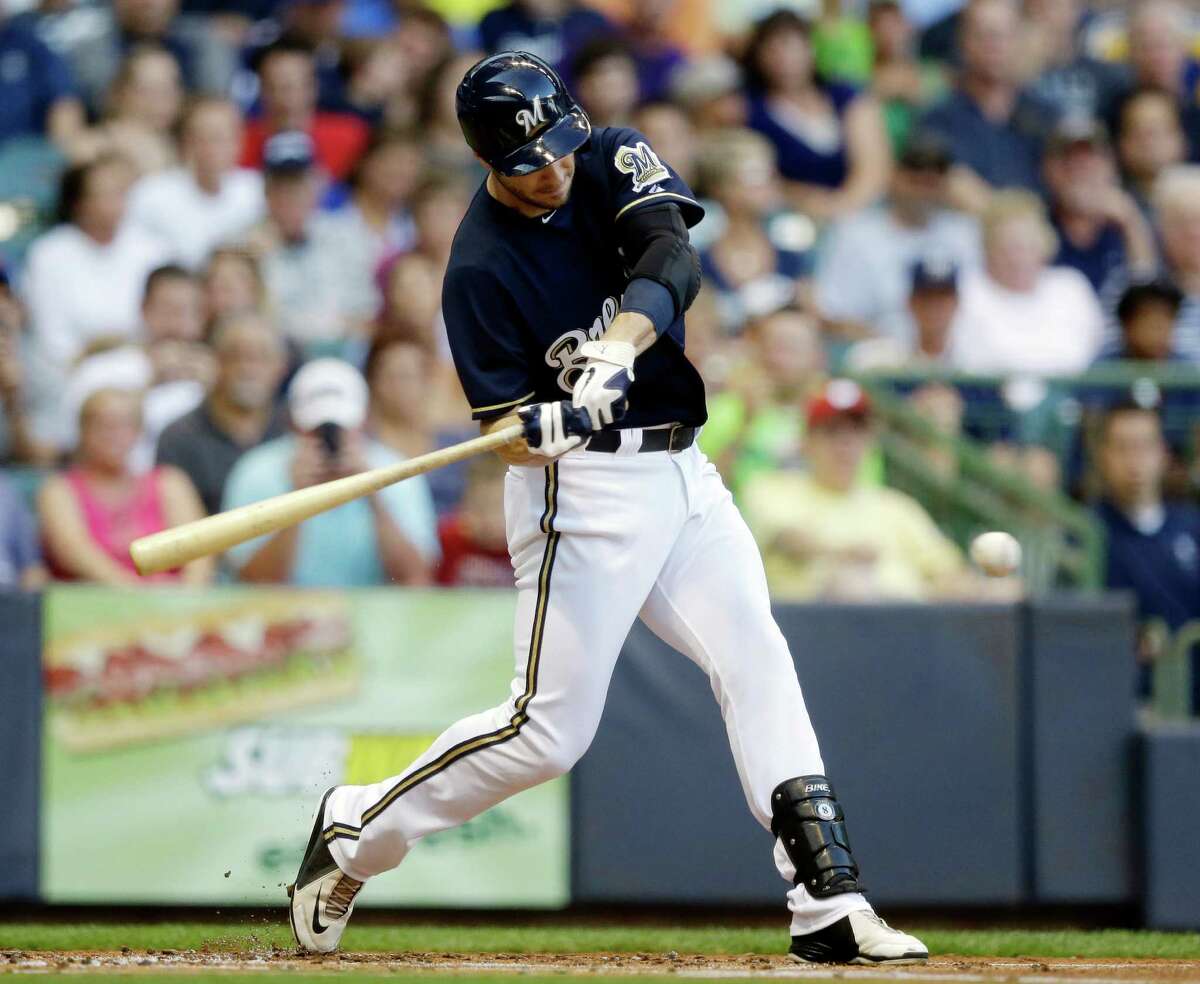 Milwaukee Brewers' Ryan Braun hits a single during the first inning of a baseball game against the Cincinnati Reds Tuesday, July 9, 2013, in Milwaukee.