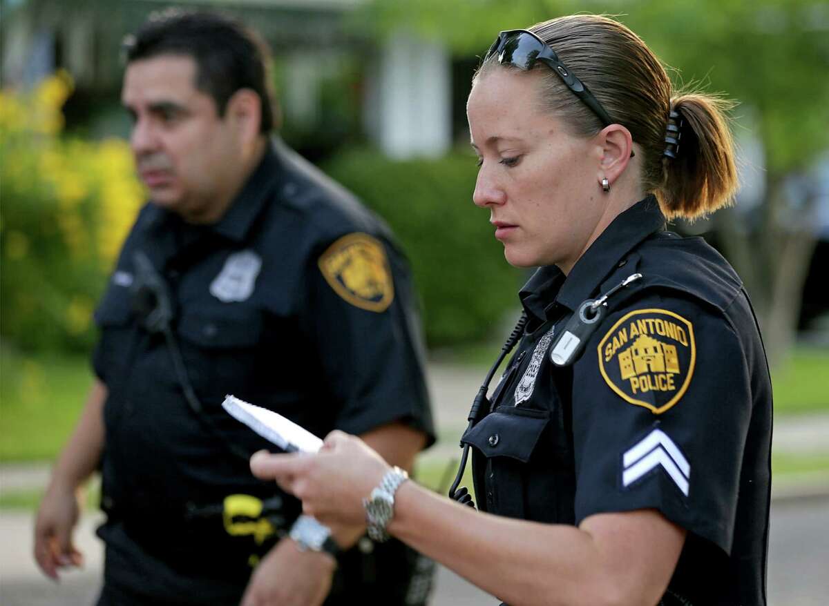 San Antonio Police Detective Stephanie Landry, right, answers a disturbance call with Officer E. Vargas on South Side patrol on Wednesday, July 10, 2013.