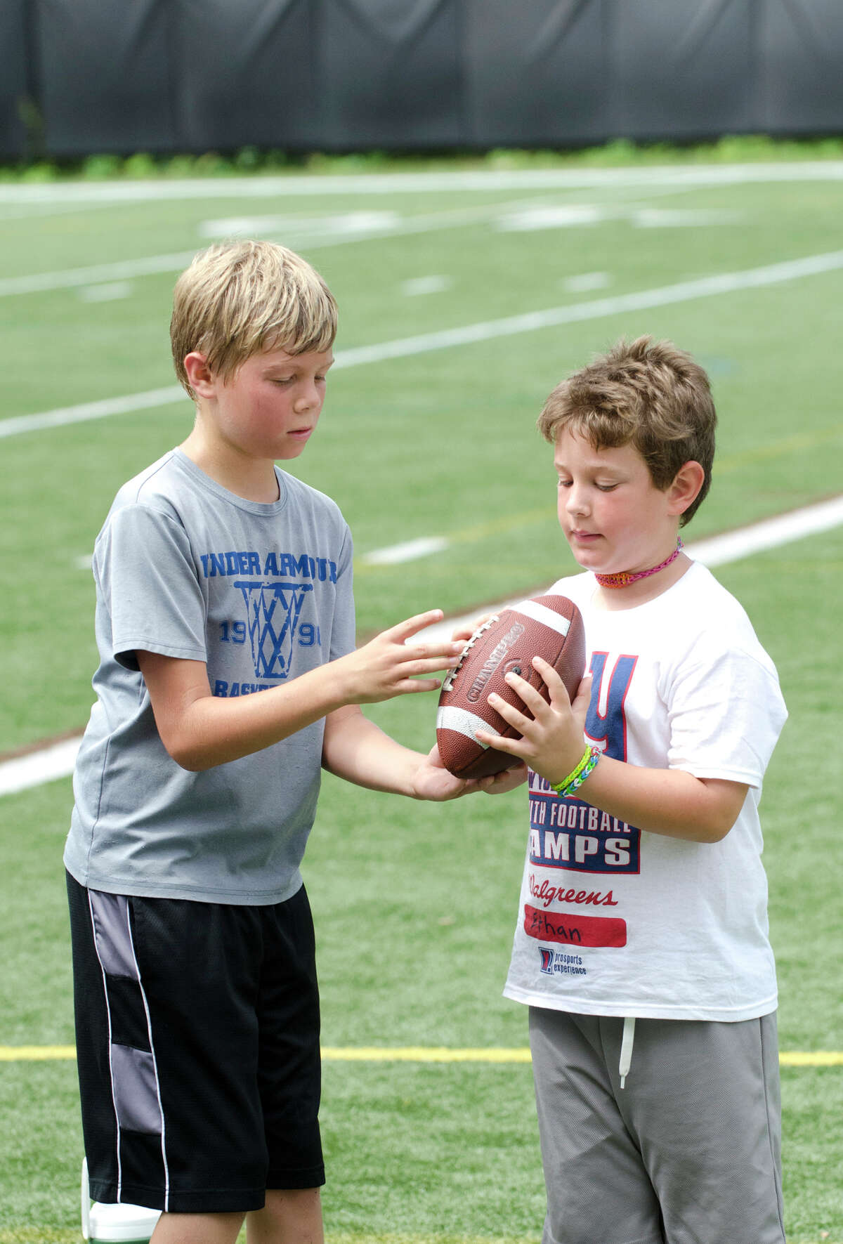 Norwalk football players enjoy five-day New York Giants youth camp at St.  Luke's High School