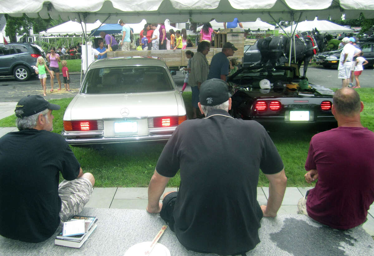 Idling away the hours alongside friends was a reasonable alternative for those on hand during the Washington Congregational Church's annual Green Fair, July 13, 2013.