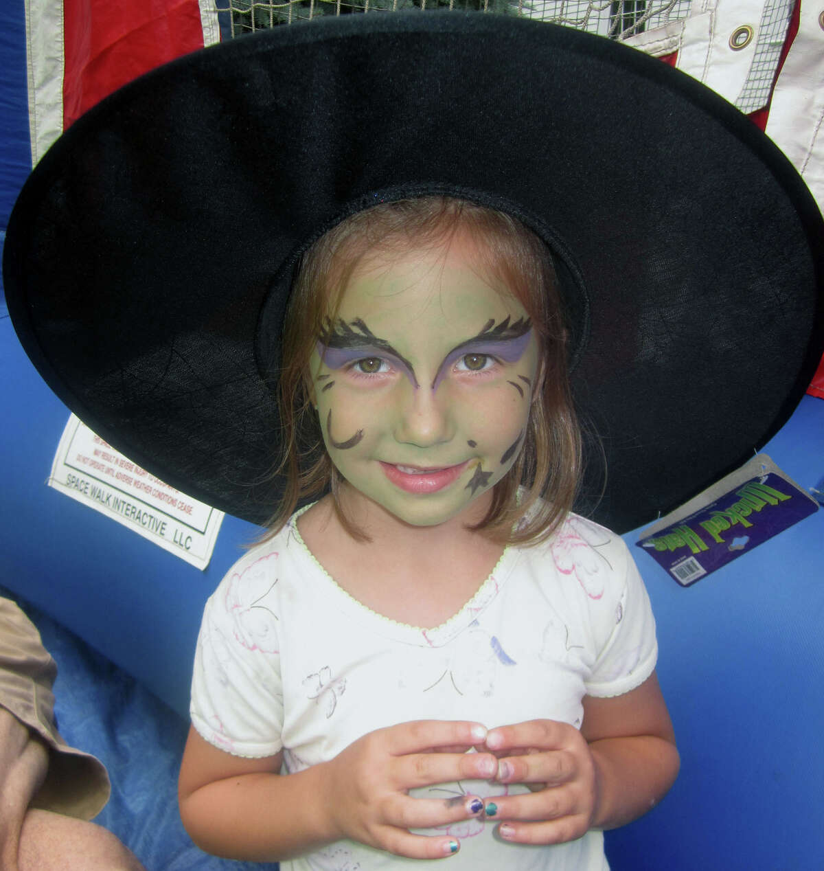 Wynne Lewis, 5, of Thomaston is surely one of the more bewitching patrons of the Washington Congregational Church's annual Green Fair, July 13, 2013.