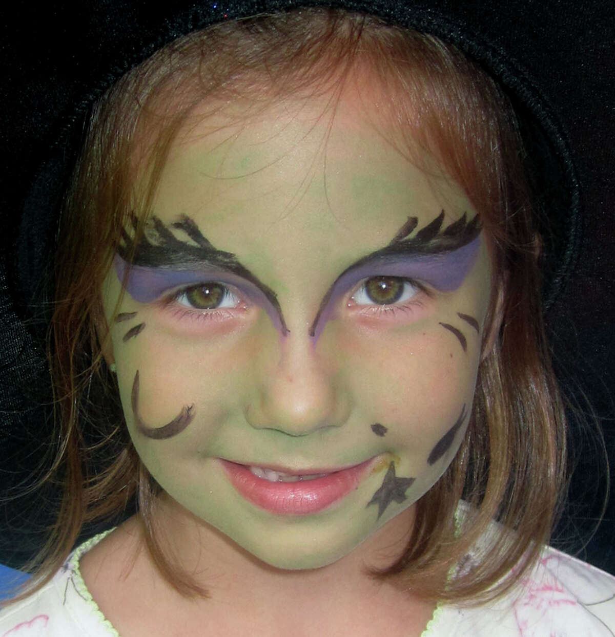 Wynne Lewis, 5, of Thomaston is surely one of the more bewitching patrons of the Washington Congregational Church's annual Green Fair, July 13, 2013.