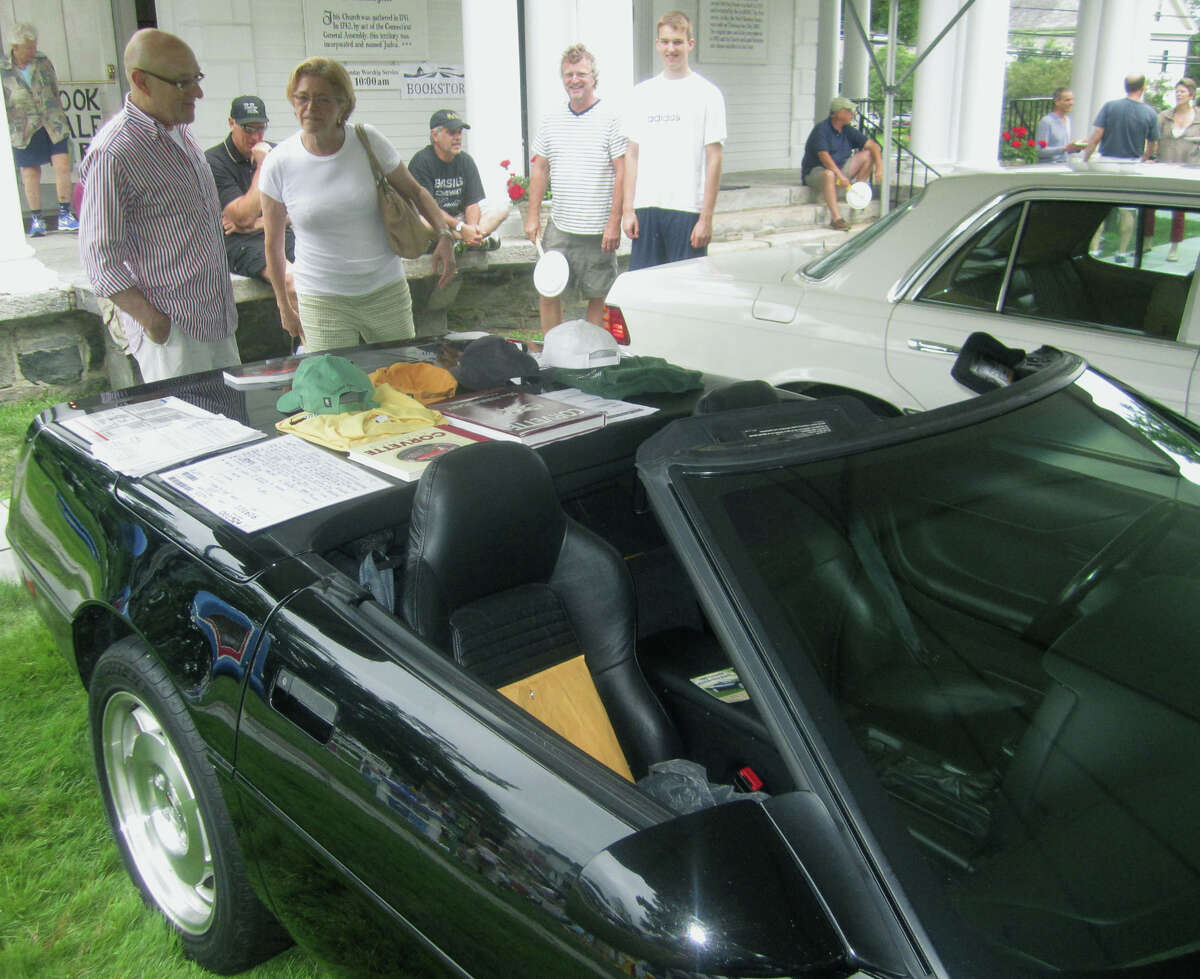 A vintage Corvette for auction attracts a steady stream of inquisitive patrons during the Washington Congregational Church's annual Green Fair, July 13, 2013.