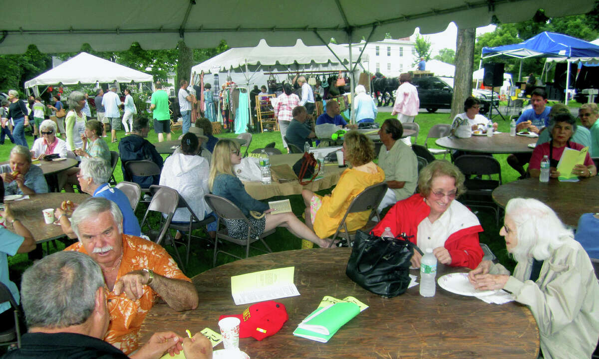Madeline Revere and Jean Crosby, right, of Washington are among the many who find a spot to relax under the lunch tent during the Washington Congregational Church's annual Green Fair, July 13, 2013.