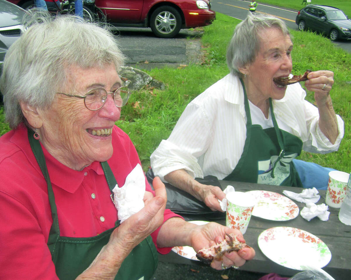 Forever young church volunteer Norma Anson, 89, and her sister, Mary Rivers, 87,take a quick break to grab lunch during the Washington Congregational Church's annual Green Fair, July 13, 2013. The sisters were baptized in the church more than a few fortnights ago.