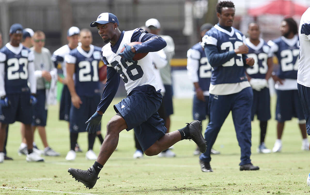 Receiver Dez Bryant runs into the open during the morning session of the 2013 Dallas Cowboys training camp on Wednesday, July 24, 2013 in Oxnard.