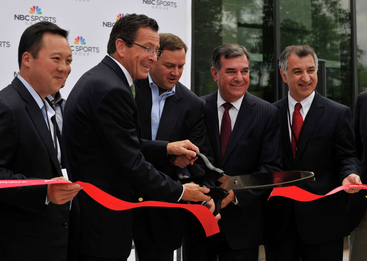 From left State Rep. William Tong, Gov. Dannel Malloy, NBC Sports Group chairman Mark Lazarus, Mayor Michael Pavia and State Sen. Carlo Leone cut the ceremonial ribbon during the grand opening of the NBC Sports Group facility in Stamford on Wednesday, July 24, 2013.