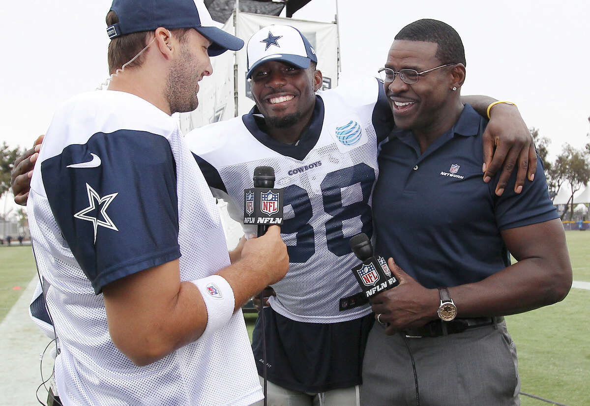 Tony Romo (from left), Dez Bryant and former Cowboy Michael Irvin gather for an interview by Irvin after the afternoon session of the 2013 Dallas Cowboys training camp on Wednesday, July 24, 2013 in Oxnard.