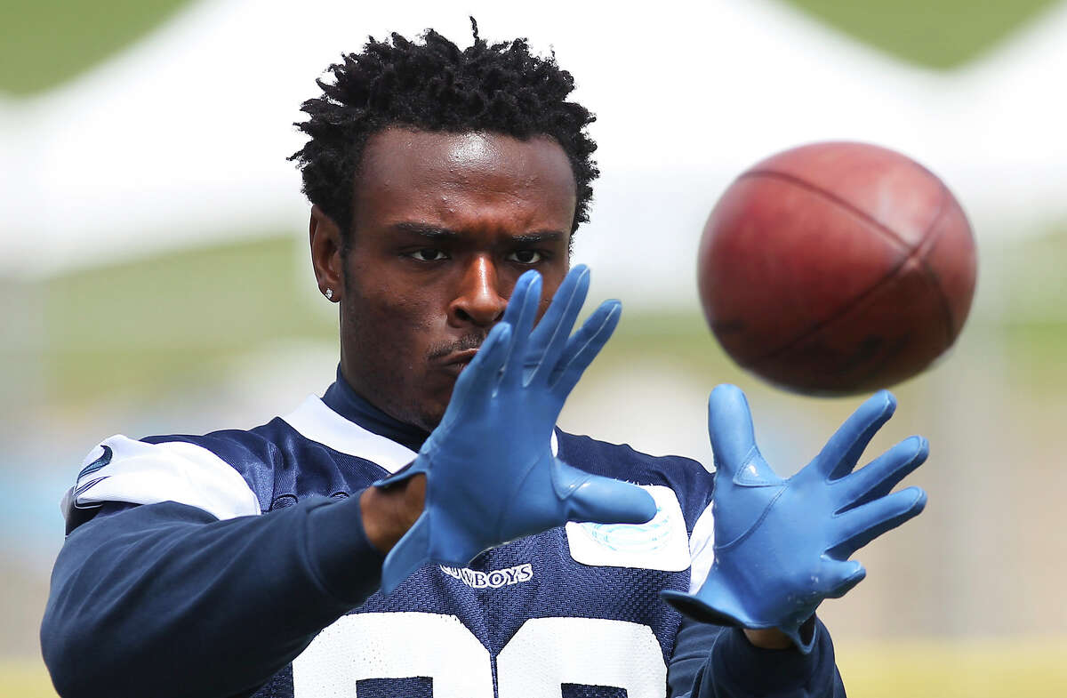 Cornerback Brandon Carr focuses on catch a ball during ball machine drills at the morning session of the 2013 Dallas Cowboys training camp on Wednesday, July 24, 2013 in Oxnard.