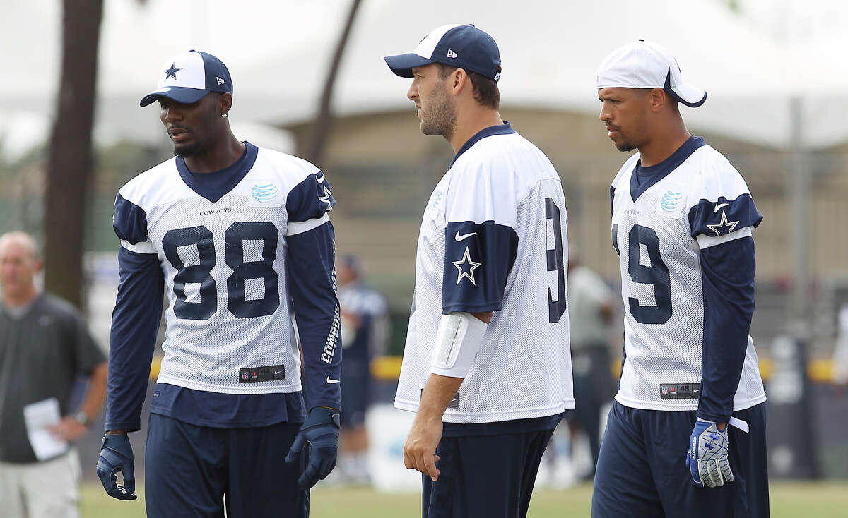 Dez Bryant (from left), Tony Romo and Miles Austin work on plays during the morning session of the 2013 Dallas Cowboys training camp on Wednesday, July 24, 2013 in Oxnard.