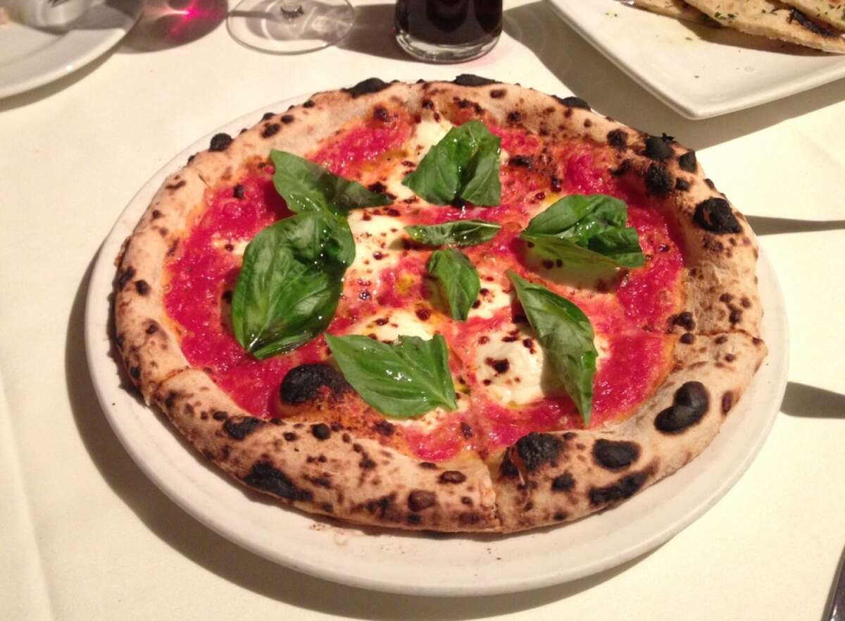 Pizza Margherita with tomato, mozzarella, basil and olive oil ($13)