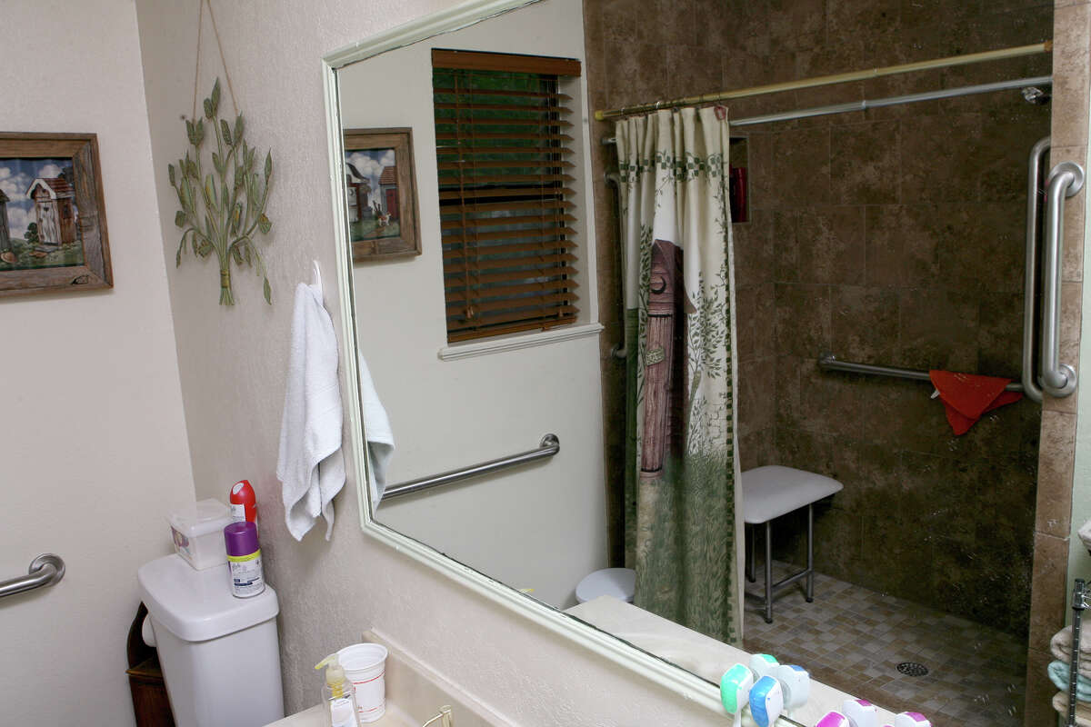 Hector and Maria Marin's bathroom in their Floresville home was redone through the Texas Veterans Commission's Housing4TexasHeroes program to alleviate some of the problems the couple was having due to mobility limitations. The new shower has a low step to get in, much easier than stepping over the side of the old bathtub. The door to the bathroom was widened for easier access, the floor was done to match the shower and the walls were painted as well. The work on the bathroom was completed in May 2013 and took less than a month to complete.