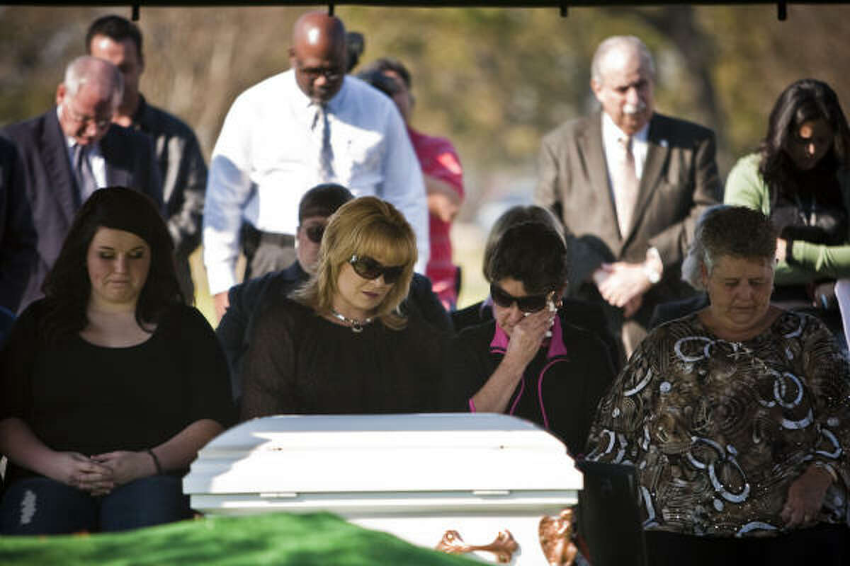 Audrey LaJaunie, Kim Gomez, Cindi Michalk and Shirley Lyles mourn at the service. Mourners included relatives of another suspected Corll victim, Joseph Lyles.