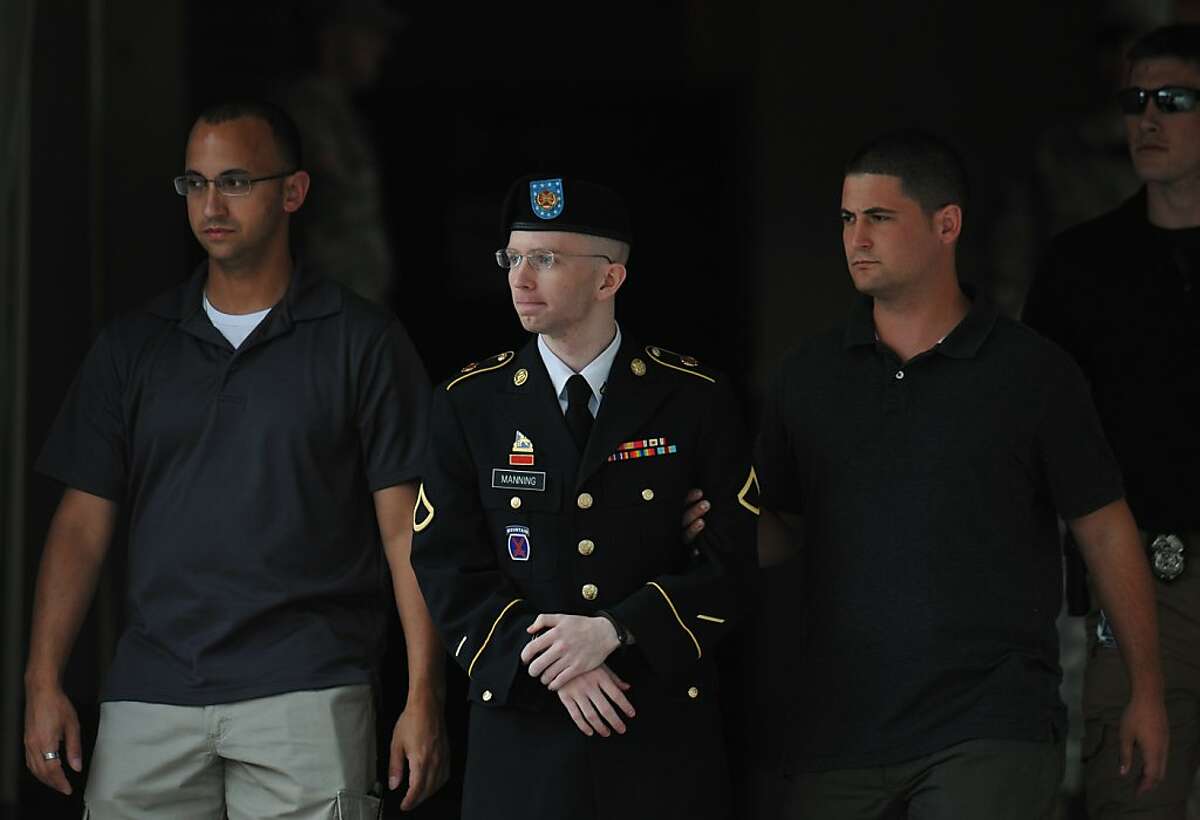 Army Pfc. Bradley Manning is escorted from court on July 25, 2013 in Fort Meade, Maryland on July 25, 2013. The trial of Manning, accused of "aiding the enemy" by giving secret documents to WikiLeaks, is entering its final stage Thursday as both sides present closing arguments. AFP PHOTO/Mandel NGANMANDEL NGAN/AFP/Getty Images