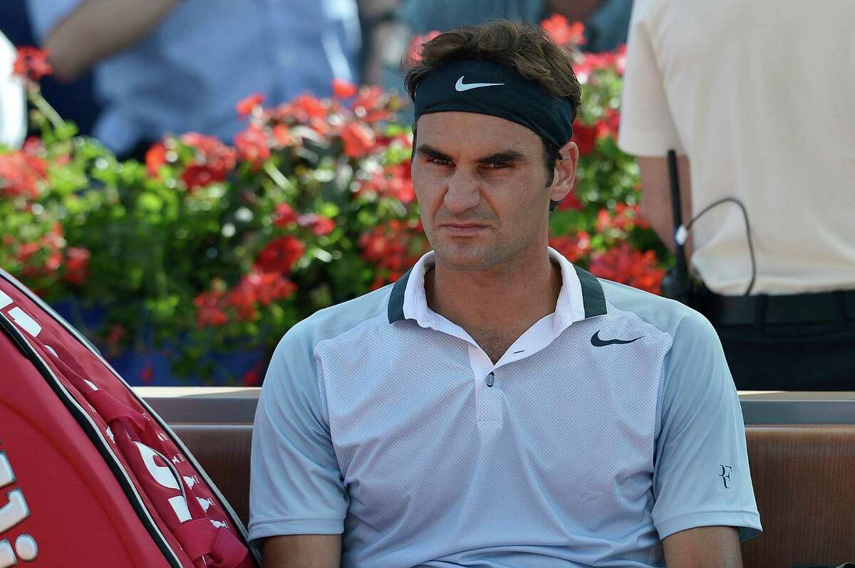 Roger Federer of Switzerland reacts during his match against Daniel Brands of Germany, a second round match of the Suisse Open tennis tournament in Gstaad, Switzerland, Thursday July 25, 2013. (AP Photo/Keystone/Peter Schneider) ORG XMIT: PS119