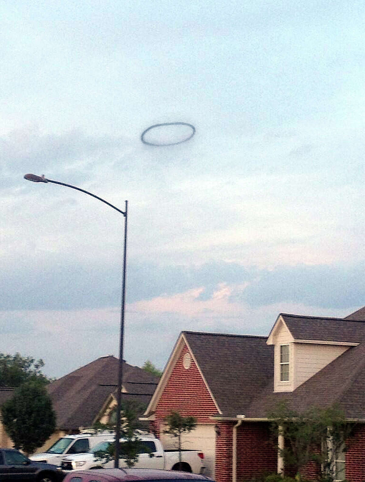 A smoke ring rises over College Station after an explosion July 25, 2013. (James E. Miculka via Twitter)