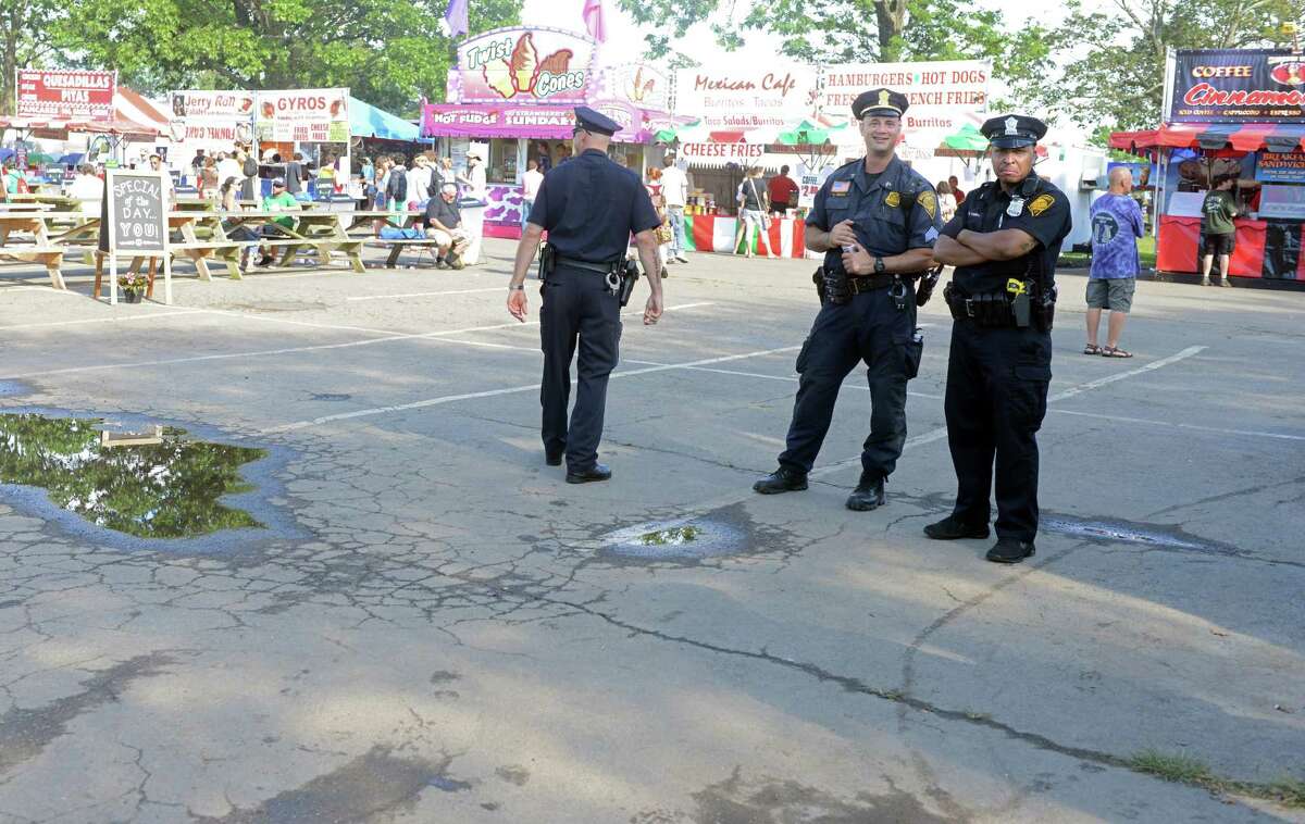 Bridgeport police officers patrol the 18th annual Gathering of the Vibes Musical Festival at Seaside Park in Bridgeport, Conn. Friday, July 26, 2013.