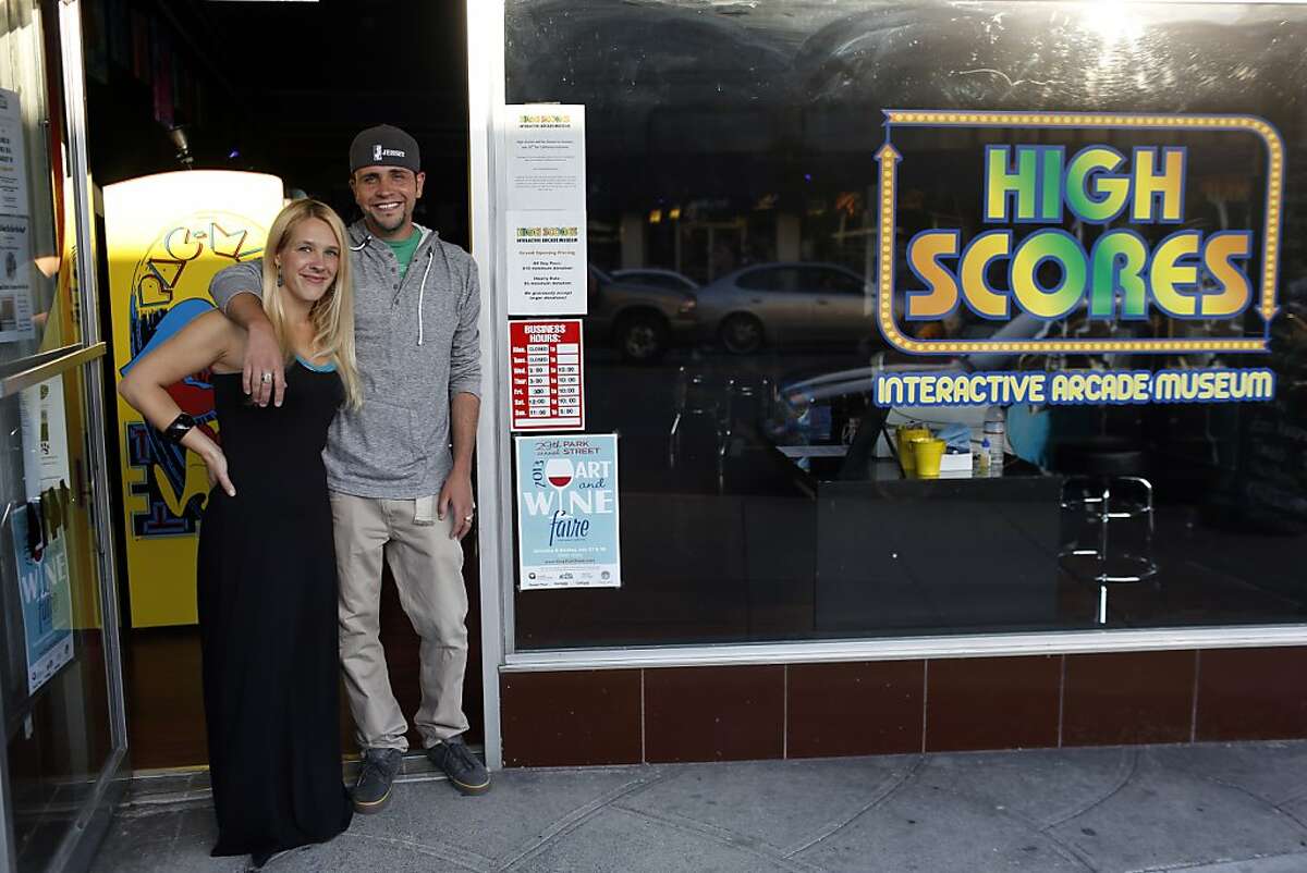 Owners Shawn and Megan Livernoche pose for a portrait in the doorway of their arcade at the High Score arcade in Alameda, California on July 12, 2013.