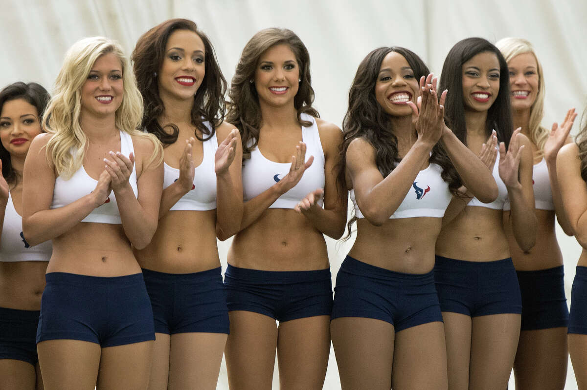 Finalists for the 2013 Houston Texans Cheeleaders applaud as former President George H.W. Bush is announced during a ceremony announcing the new squad at the Texans training facility.