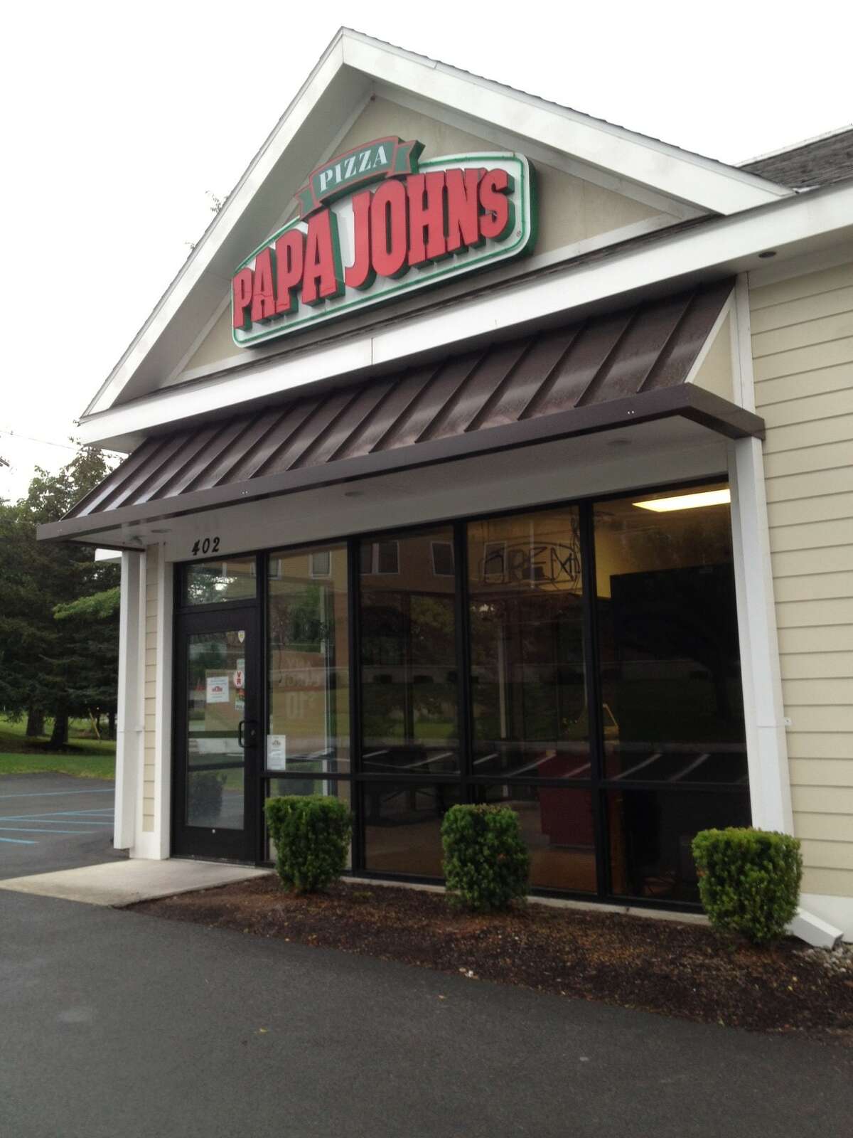 The Papa John's restaurant at the corner of Everett and Albany Shaker roads in Latham was one of six local Papa John's owned by franchisee Christian King, abruptly closed all six locations without advance warning on Saturday. (Paul Grondahl / Times Union)