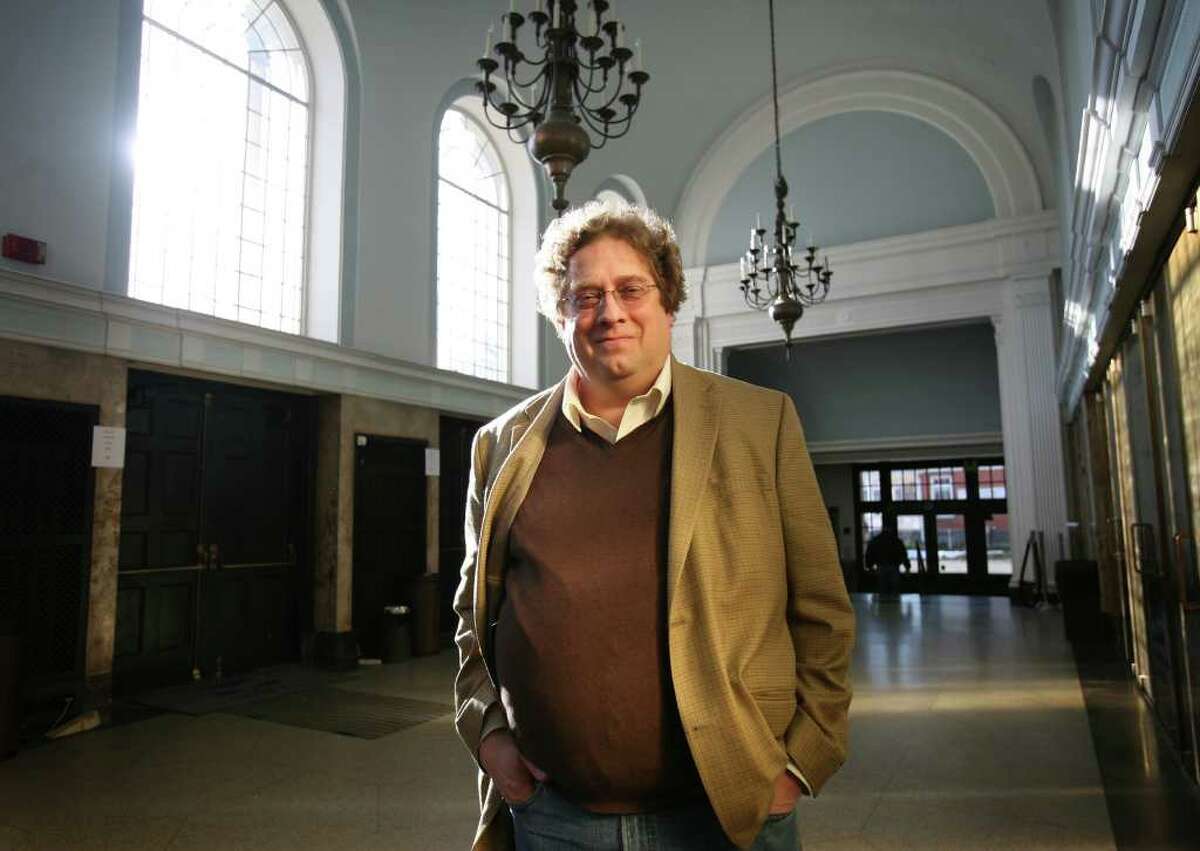 Miles Marek, producing director of the Klein in Bridgeport, in the building's dramatic outer lobby.